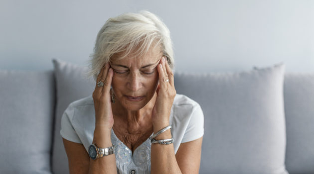 woman having migraine