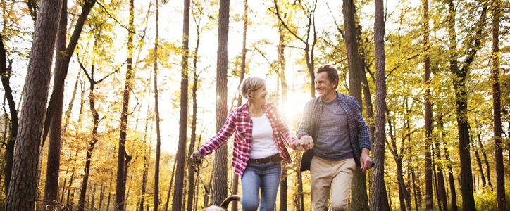 couple walking dog