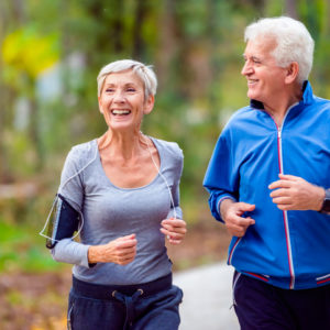 smiling couple jogging