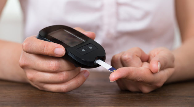 person checking blood sugar