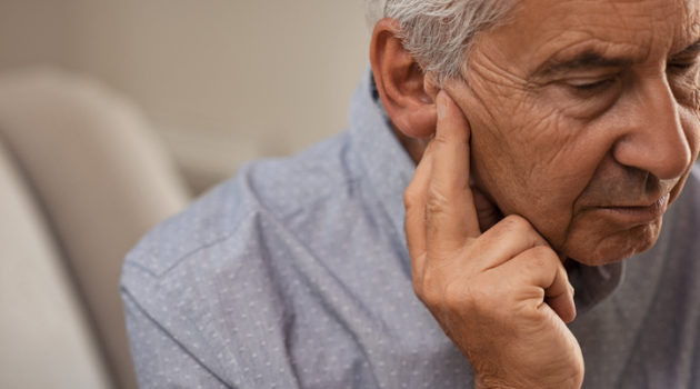 senior man with hearing problems