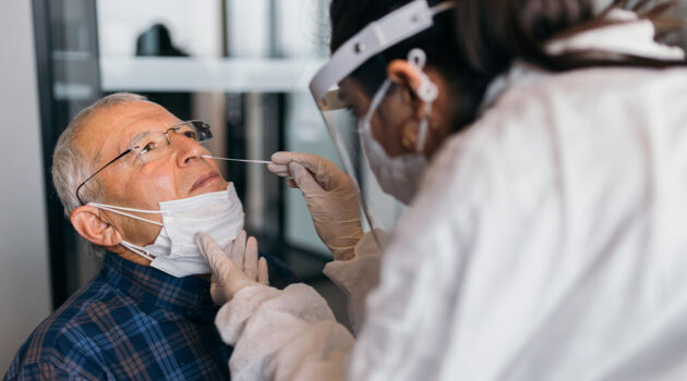 Doctor examining patient orally.