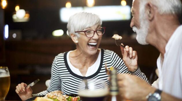 Two older people talking.