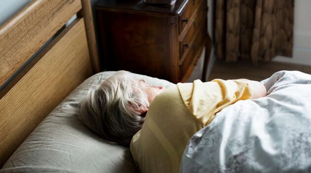 Woman laying in bed.