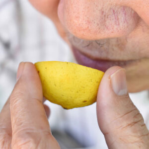 Man smells lemon to test his heart health