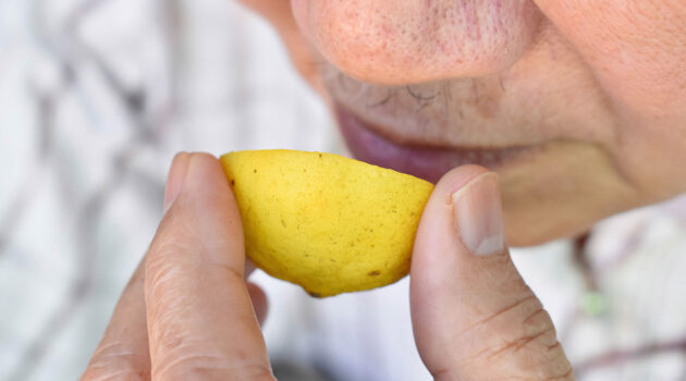 Man smells lemon to test his heart health